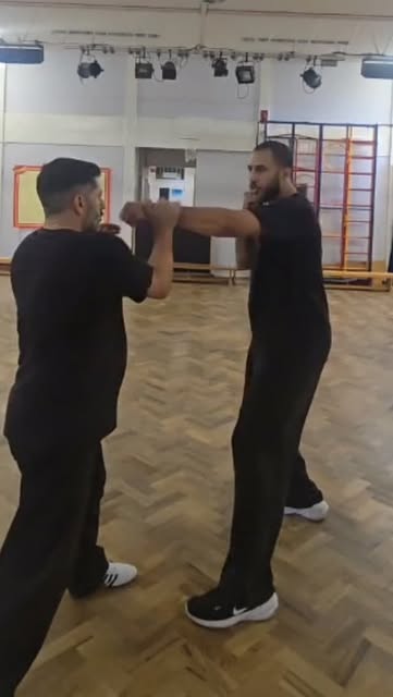 Tai Tsung students practising a partner drill in the training hall